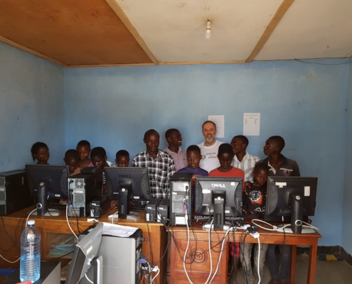 Robert Porter and students in an Internet for Humanity equipped classroom in Uganda