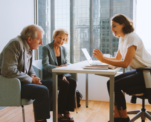 A financial advisor speaking to her clients, illustrating Canada Gives CEO Denise Castonguay explores the benefits of DAFs on The Sunday Money Show