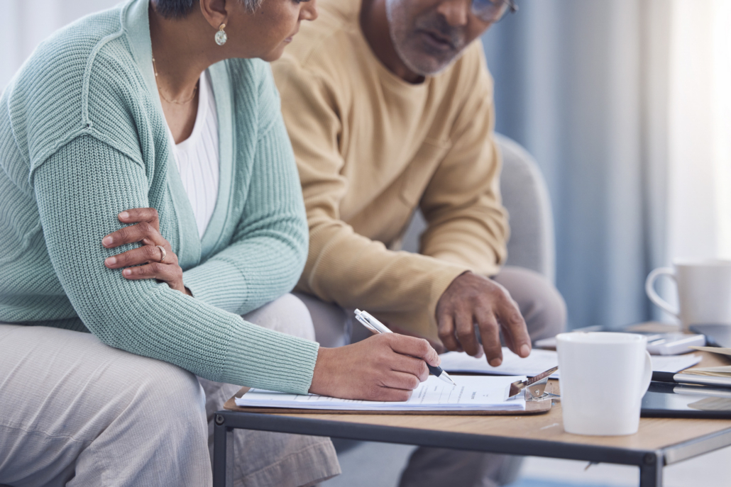 A couple discussing donating and unneeded insurance policy